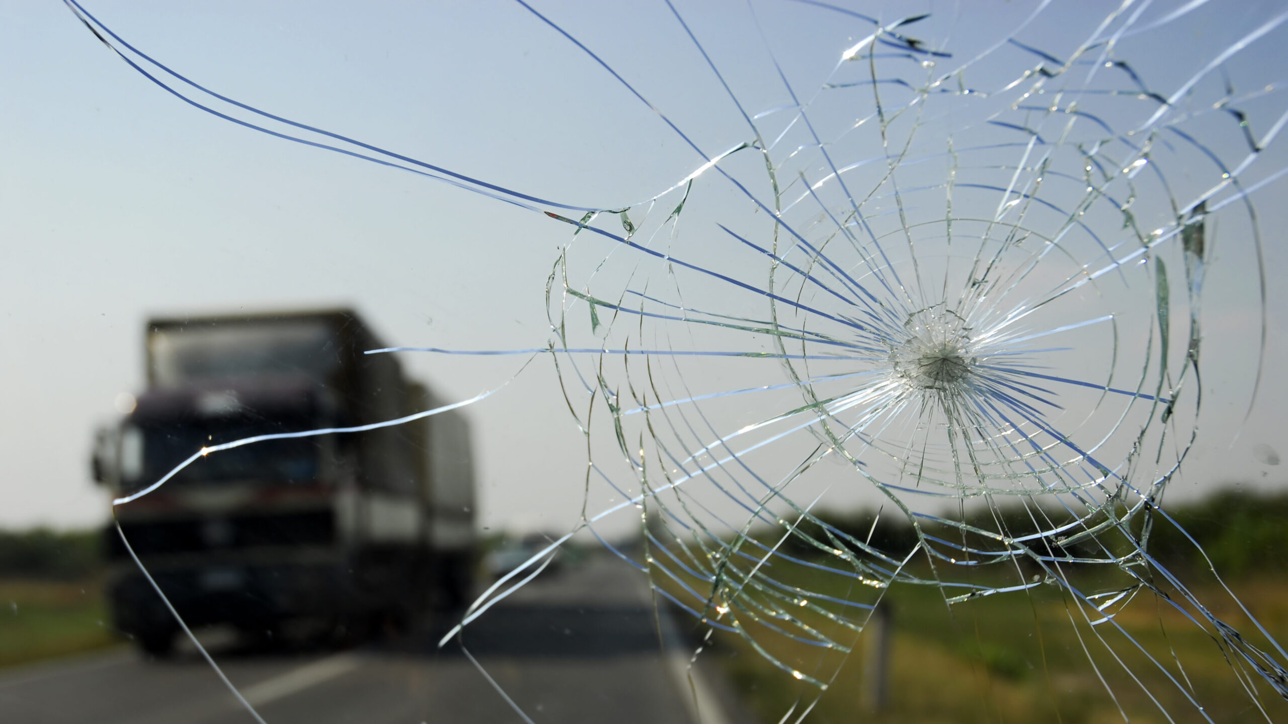 Close-up of a cracked car windshield before professional repair in McKinney, TX